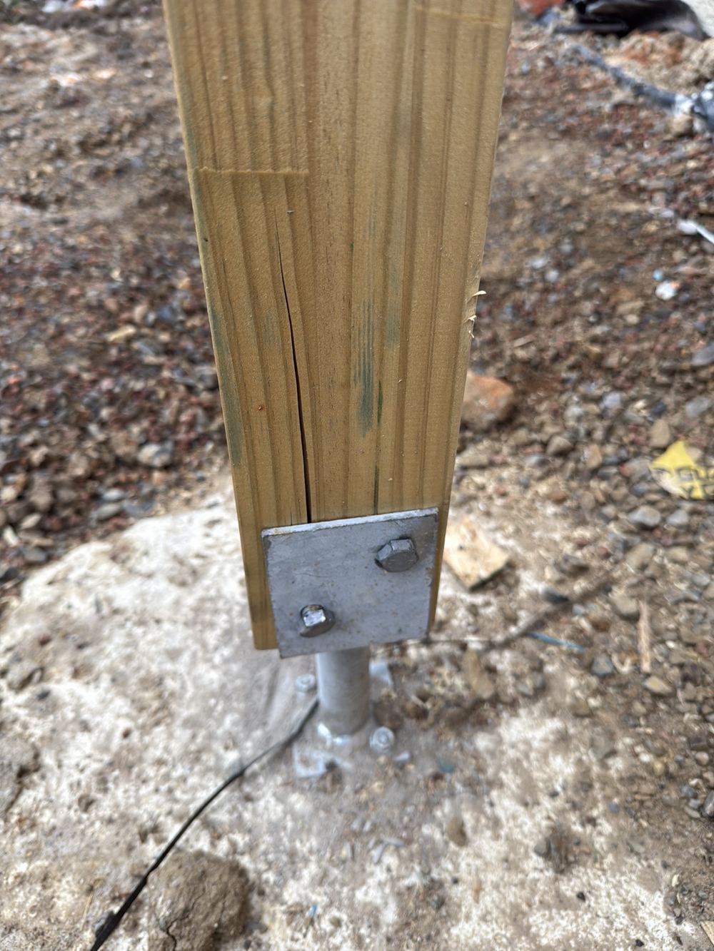 Timber post split open by coach screws driven in badly, found during a frame inspection in Berwick