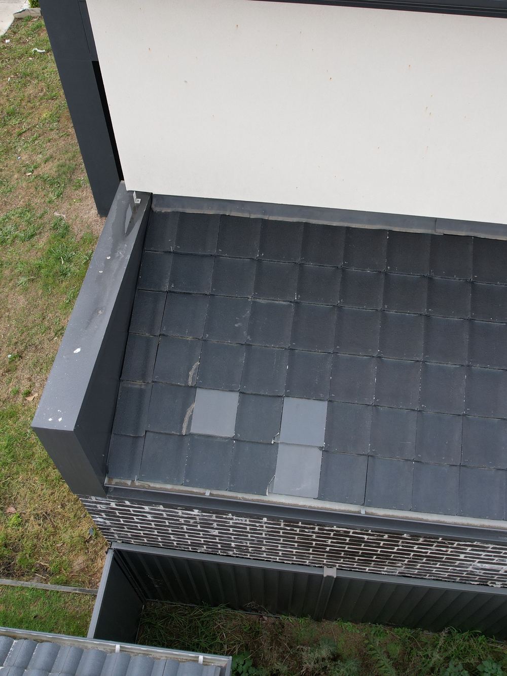 Cracked roof tiles relying on silicone to keep the water out, found during a defect investigation in Berwick