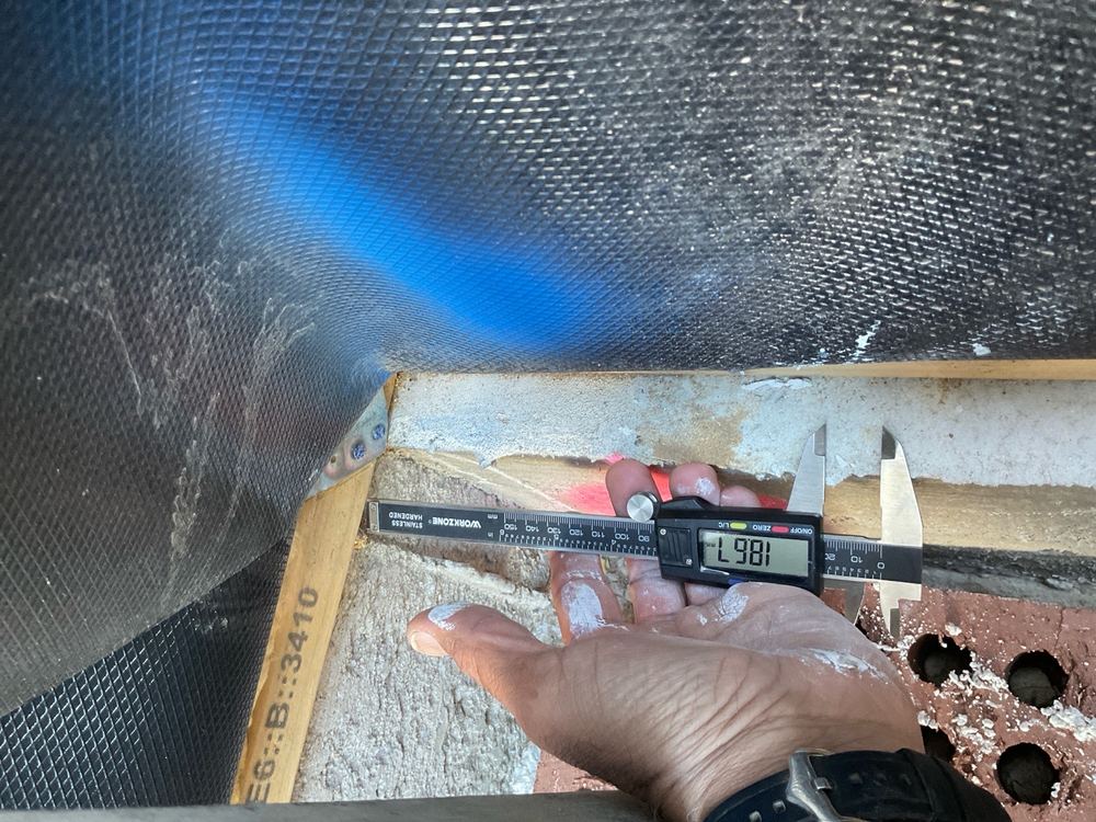 Timber bottom plate overhanging the slab by more than 10mm, found during a lock-up inspection in Berwick
