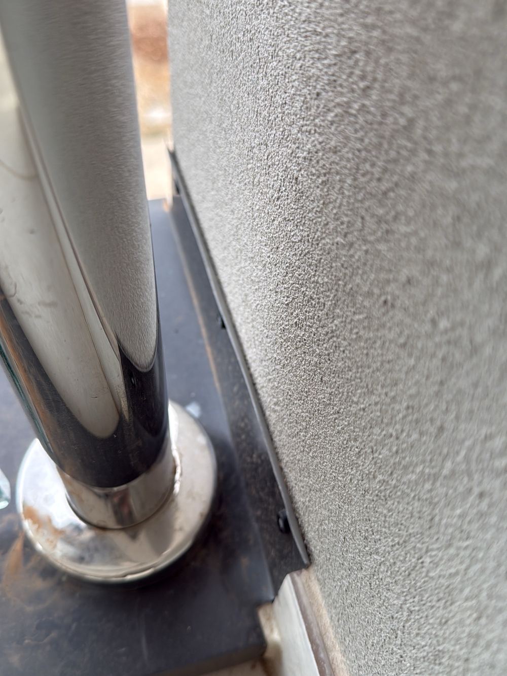 Pressure flashing left unsealed, with gaps letting water in behind, found during a pre-handover inspection in Berwick