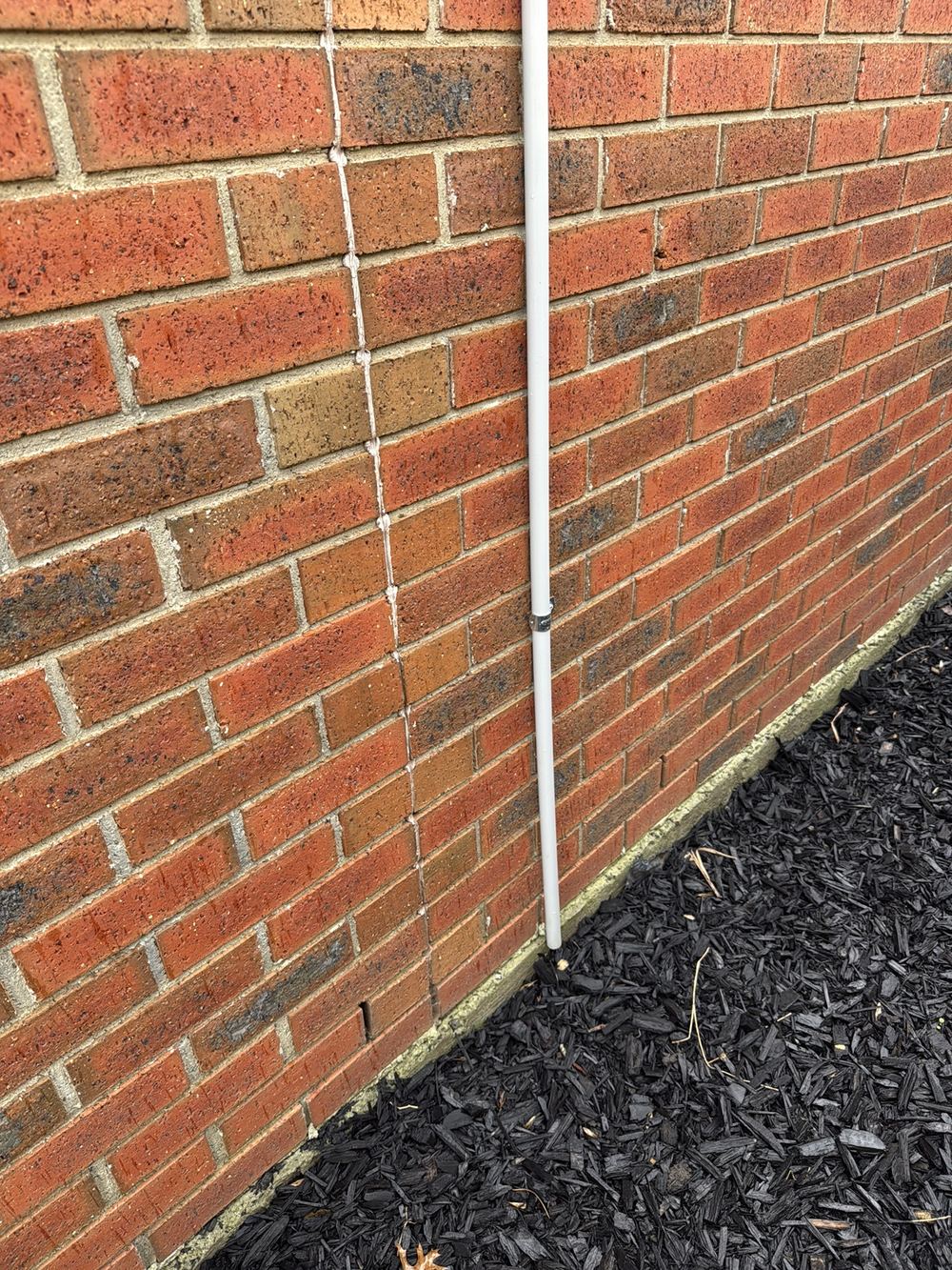 Air conditioner condensate draining right beside the external wall, found during a pre-purchase inspection in Berwick