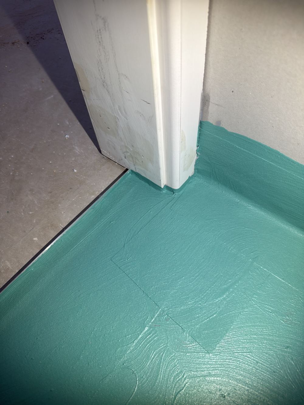 Wet area membrane detailing short of the current waterproofing standard, found during a waterproofing inspection in Berwick